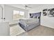 Comfortable bedroom with a tufted headboard, dresser, and soft rug at 5108 Avignon Ct, Orlando, FL 32839