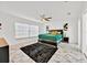 Spacious bedroom with stylish marble floors, modern lighting, and ample natural light from large windows at 5108 Avignon Ct, Orlando, FL 32839