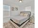 Cozy bedroom featuring plush pillows, a modern ceiling fan, and bright, sunlit windows for a peaceful ambiance at 5108 Avignon Ct, Orlando, FL 32839