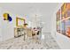 Bright dining room featuring elegant furniture, modern light fixture, and large mirror at 5108 Avignon Ct, Orlando, FL 32839