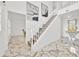 Bright entryway with marble floors, staircase, modern decor, and natural light at 5108 Avignon Ct, Orlando, FL 32839