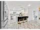 Modern kitchen with stainless steel appliances, a breakfast bar, and white cabinetry at 5108 Avignon Ct, Orlando, FL 32839
