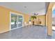 Relaxing covered patio with a hanging chair and lush landscaping at 5108 Avignon Ct, Orlando, FL 32839
