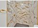 Luxurious shower featuring marble tiling, gold fixtures, and a modern design at 5108 Avignon Ct, Orlando, FL 32839