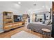 Large bedroom with a TV, gaming chair, and unique furnishings at 5150 Banana Point Dr, Okahumpka, FL 34762