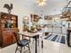 Cozy kitchen and dining area featuring white cabinetry and modern appliances, creating a functional space at 5150 Banana Point Dr, Okahumpka, FL 34762