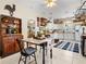 Charming kitchen featuring white appliances, wood countertops, a tile floor, with seating area at 5150 Banana Point Dr, Okahumpka, FL 34762