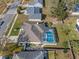 High-angle aerial view of the home featuring a screened pool and backyard at 5173 Clarion Oaks Dr, Orlando, FL 32808