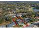 Elevated view of property in a tree-filled community featuring a screened pool at 5173 Clarion Oaks Dr, Orlando, FL 32808