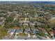 High-angle aerial view of the community with a home featuring a screened pool at 5173 Clarion Oaks Dr, Orlando, FL 32808