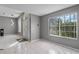 Bright foyer with tile flooring, modern lighting, and a large window offering natural light at 5173 Clarion Oaks Dr, Orlando, FL 32808