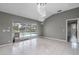 Bright living room with tiled floors, glass doors to pool, and modern lighting at 5173 Clarion Oaks Dr, Orlando, FL 32808