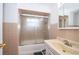 Bathroom with a sliding glass shower door, and a vanity with sink at 5214 E Kaley St, Orlando, FL 32812