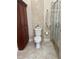 Bathroom featuring a toilet, shower with glass door and tile flooring at 5337 Watervista Dr, Orlando, FL 32821