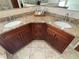 Bathroom vanity featuring double sinks, granite countertop, and dark wood cabinetry at 5337 Watervista Dr, Orlando, FL 32821