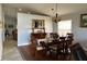 Bright dining room with hardwood floors, a decorative mirror, and traditional wood furniture at 5337 Watervista Dr, Orlando, FL 32821