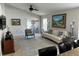 Inviting living room with neutral colors, a ceiling fan, and sliding doors to the outdoor space at 5337 Watervista Dr, Orlando, FL 32821