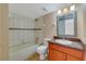 Well-maintained bathroom with a shower-tub combo, vanity and a neutral color scheme at 6142 Westgate Dr # 102, Orlando, FL 32835