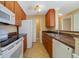 Well-lit kitchen area featuring tile floors and ample counter space at 6142 Westgate Dr # 102, Orlando, FL 32835