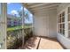 Enclosed patio with tiled floor, neutral walls, and screened enclosure, offering natural light at 6142 Westgate Dr # 102, Orlando, FL 32835