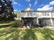 Exterior shot of a backyard with screened porches at 6292 Twain Street # 108, Orlando, FL 32835