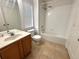 Bright bathroom featuring a tub-shower, single vanity and window at 6292 Twain Street # 108, Orlando, FL 32835