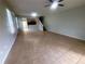 Open living room features tile floors, staircase, and view of the kitchen at 6292 Twain Street # 108, Orlando, FL 32835