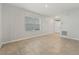 Cozy living room featuring tile flooring and a bright window at 6745 Huntleigh Hammock Rd, Harmony, FL 34773