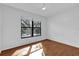 Bedroom featuring hardwood floors and natural light from the window at 705 Northlake Dr # 705, Sanford, FL 32773