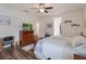 Comfortable bedroom features an ensuite, walk-in closet, and contemporary decor at 739 Annabell Ridge Rd, Minneola, FL 34715