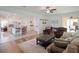 Open-concept living room featuring the kitchen with a center island and barstool seating at 739 Annabell Ridge Rd, Minneola, FL 34715