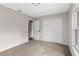 A bedroom featuring soft carpeting, a closet, and a window for ample natural light at 7427 Houston E Ct, Winter Park, FL 32792