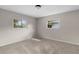 Bright, carpeted bedroom with natural light from two windows at 7427 Houston E Ct, Winter Park, FL 32792