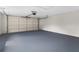 Spacious two-car garage with painted floor and white walls, ready for vehicles and storage at 7427 Houston E Ct, Winter Park, FL 32792