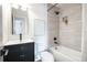 Stylish bathroom featuring a shower-tub combo and a modern vanity with a sleek faucet at 8042 Tompkins Sq, Orlando, FL 32807