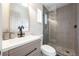 Modern bathroom with a glass-enclosed shower, sleek vanity, and contemporary fixtures at 8042 Tompkins Sq, Orlando, FL 32807