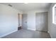 Bright bedroom featuring a closet with sliding doors and a window for plenty of light at 8042 Tompkins Sq, Orlando, FL 32807