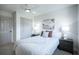 Serene bedroom with ample natural light, neutral tones, and a ceiling fan for added comfort at 8042 Tompkins Sq, Orlando, FL 32807