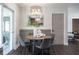 Bright dining area with modern lighting and stylish decor at 8042 Tompkins Sq, Orlando, FL 32807