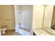 Bathroom features a shower-tub combo and single sink vanity at 8103 Lillies Way # 202, Orlando, FL 32825