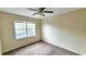 Spare bedroom featuring a window with natural light and neutral walls at 8103 Lillies Way # 202, Orlando, FL 32825