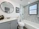Renovated bathroom with modern fixtures, decorative mirror, and shower with marble-like tile at 850 Rosalia Dr, Sanford, FL 32771