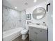 Modern bathroom with stylish vanity, and a shower featuring marble-look tiling at 850 Rosalia Dr, Sanford, FL 32771