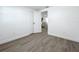 Empty bedroom featuring light gray wood-look floors, white walls, and a closet at 850 Rosalia Dr, Sanford, FL 32771