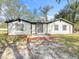Up close exterior of the house with fresh paint and a nice brick entry way at 850 Rosalia Dr, Sanford, FL 32771