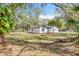 Charming single story home with black trim and a large manicured front yard at 850 Rosalia Dr, Sanford, FL 32771