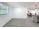 Spacious living room with light gray wood-look floors and lots of natural light at 850 Rosalia Dr, Sanford, FL 32771