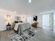 Bright main bedroom featuring recessed lighting, neutral tones, and light gray wood-look floors at 850 Rosalia Dr, Sanford, FL 32771