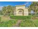 The Enclave at Moss Park entrance with manicured landscaping and signage at 9130 Sabal Pine Way, Orlando, FL 32832