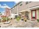 Brick patio with an umbrella, grill, and seating for outdoor entertaining in the back of the home at 9130 Sabal Pine Way, Orlando, FL 32832